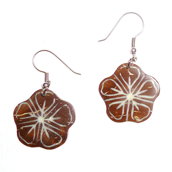 Ebony wood earrings carved in a flower shape available at Cerulean Arts.  