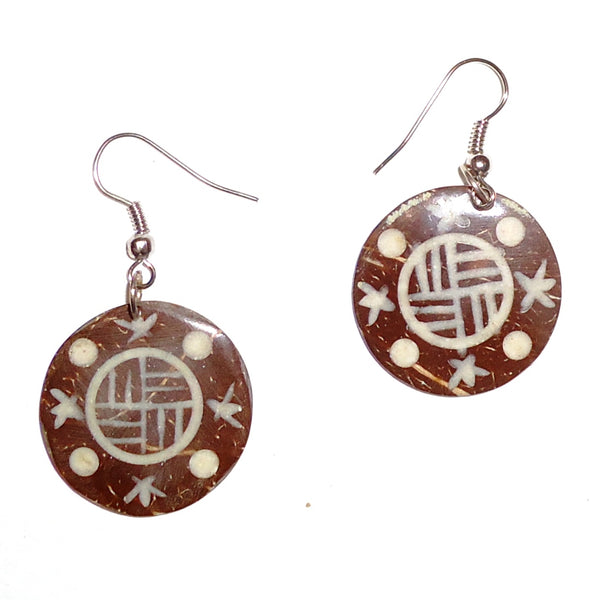 Ebony wood earrings carved in a shield design available at Cerulean Arts. 