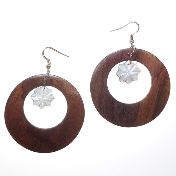 Ebony wood hoop earrings with carved shell flower available at Cerulean Arts.  
