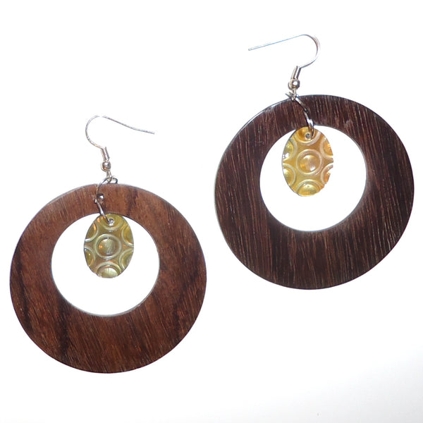 Ebony wood hoop earrings with carved shell oval available at Cerulean Arts. 