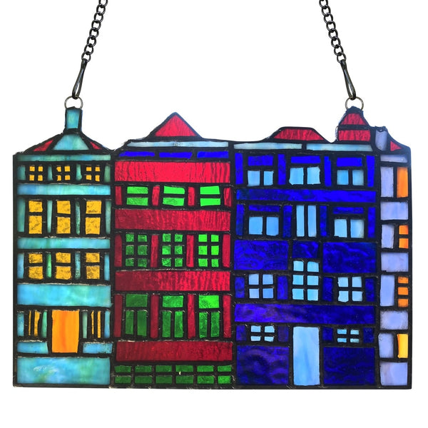 Colorful stained glass window panel with skyline of rowhouses design.