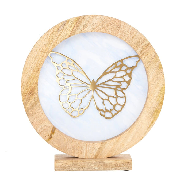 Decorative item with gold butterfly design on a blue stained glass circle inside a wooden frame