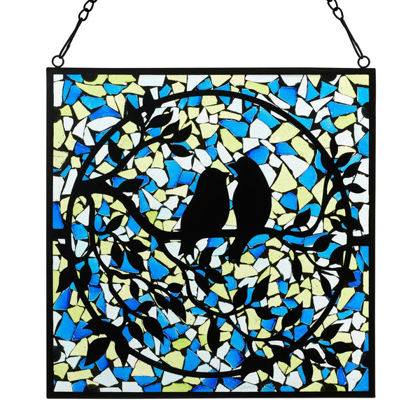 Stained glass panel with black silhouette of a bird and colorful abstract design