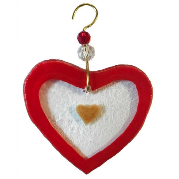 Fused glass suncatcher of a clear heart with red edge and pink center made from recycled wine bottles, available at Cerulean Arts.
