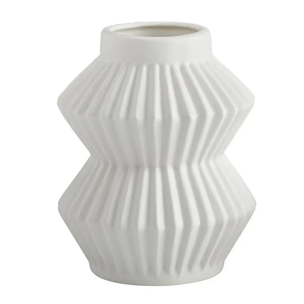 White ceramic vase featuring a stacked accordion design available at Cerulean Arts. 