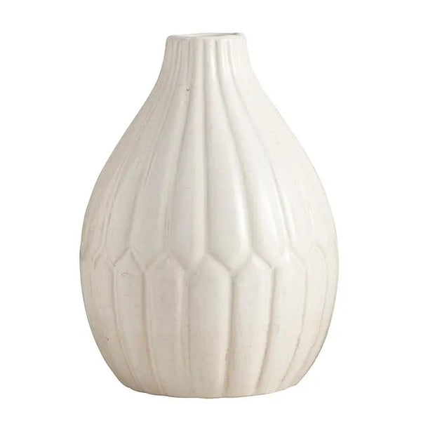 White ceramic vase featuring an engraved petal design, available at Cerulean Arts.