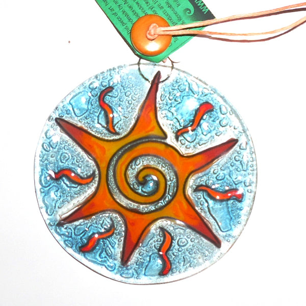 Fused glass suncatcher featuring a stylized yellow sun, available at Cerulean Arts. 