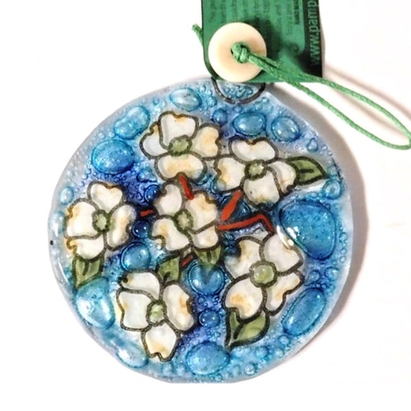 Fused glass suncatcher featuring a flowering dogwood branch available at Cerulean Arts.