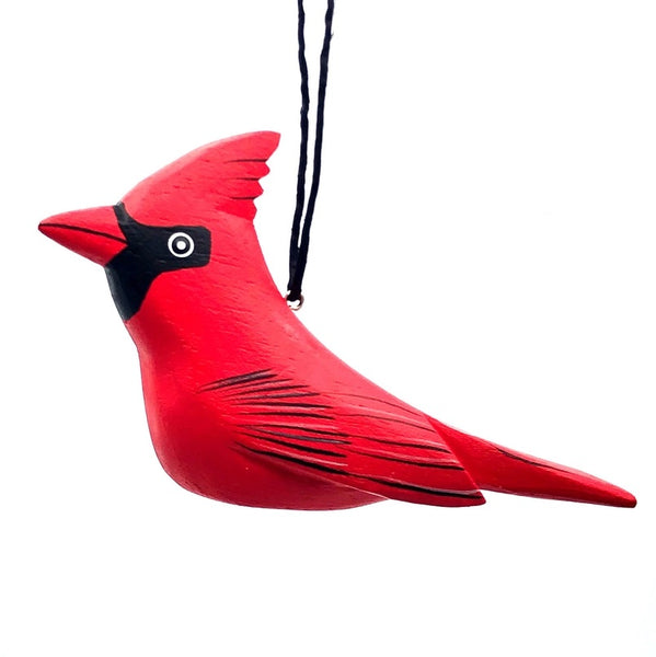 Balsa wood cardinal ornament hand-carved and painted with non-toxic acrylic paints by a cooperative of artisans on Isla Solentiname, Nicaragua, available at Cerulean Arts. 