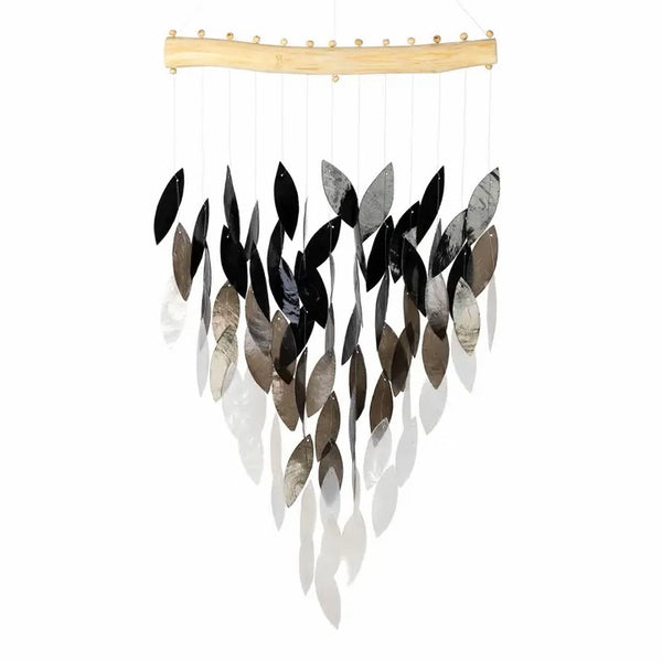 Decorative wind chime with black, gray, and white shell leaves suspended from a wooden rod