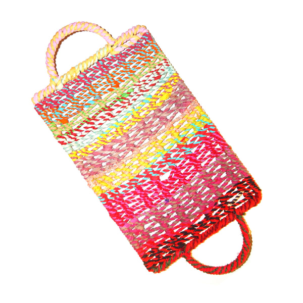 Medium, shallow rectangular tray woven in multi-colored jute with handles available at Cerulean Arts. 