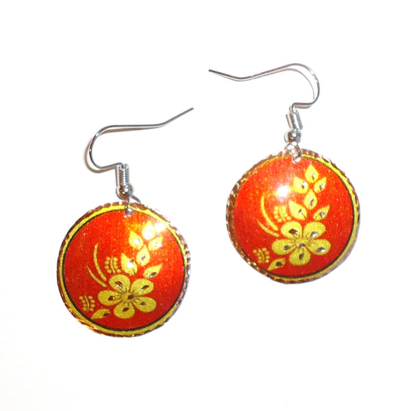 Etched copper floral earrings with orange circle design available at Cerulean Arts.