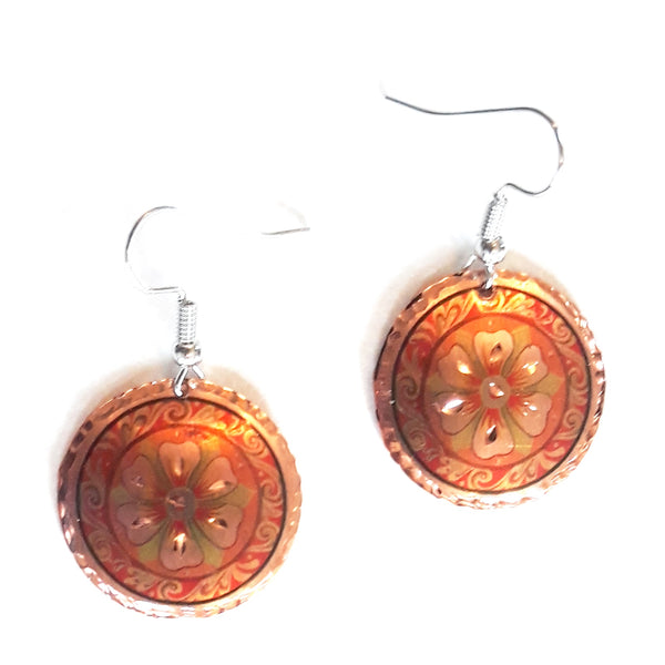 Etched copper floral earrings with orange circle design available at Cerulean Arts. 