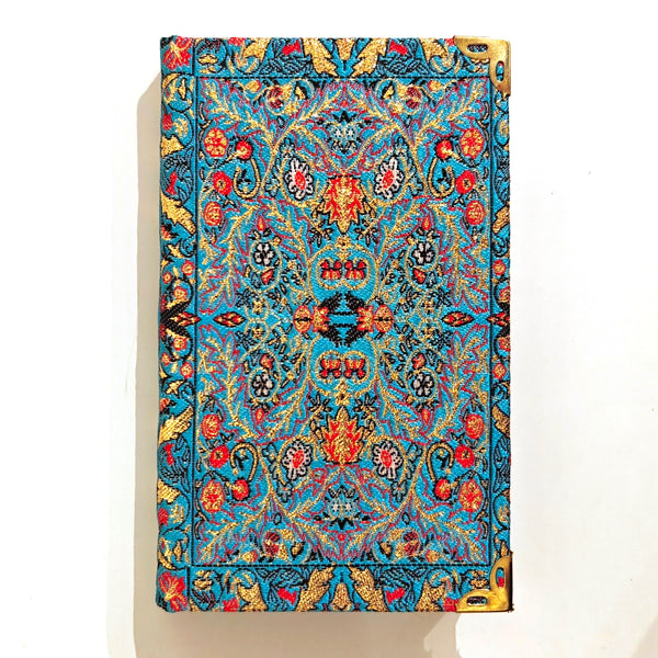Decorative notebook with intricate pattern in aqua blue