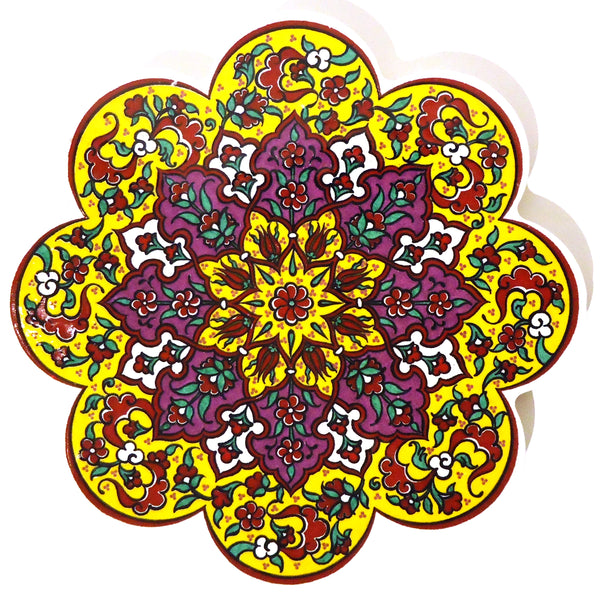 Scallop edged ceramic trivet / hot pad with colorful glazed pattern in yellow, available at Cerulean Arts.