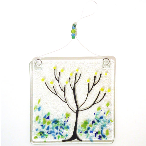 Fused glass suncatcher featuring trees in spring, available at Cerulean Arts.