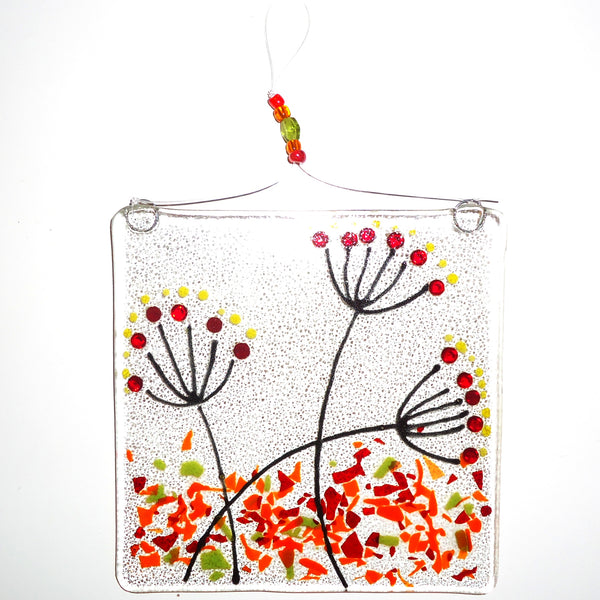 Fused glass suncatcher featuring wildflowers in autumn, available at Cerulean Arts.