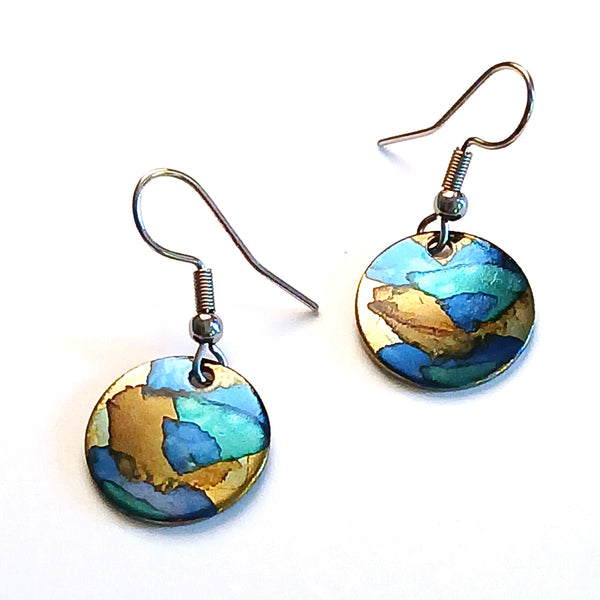 Stainless steel circle earrings hand painted with alcohol ink in blue shades, available at Cerulean Arts.