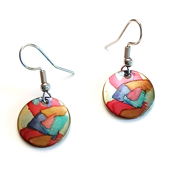 Stainless steel circle earrings hand painted with alcohol ink in red shades, available at Cerulean Arts.