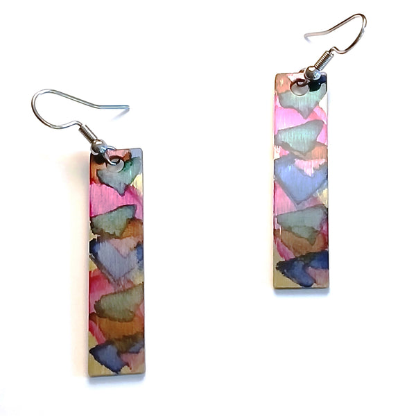 Stainless steel rectangle earrings with hand painted with alcohol ink in pink shades, available at Cerulean Arts.