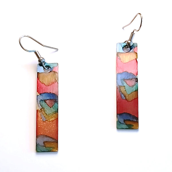 Stainless steel rectangle earrings with hand painted with alcohol ink in red shades, available at Cerulean Arts.