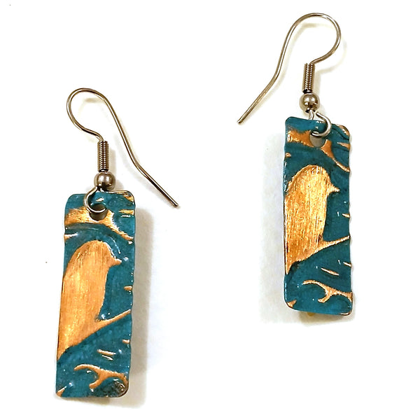 Embossed earrings with bird design