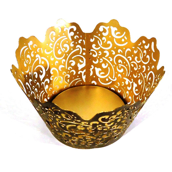 Carved metal candle holder with filigree design and antique finish, available at Cerulean Arts.