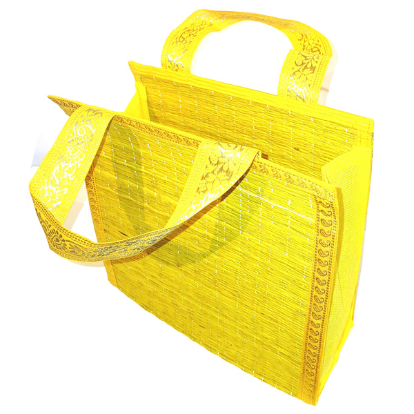 Yellow woven bag with decorative handles