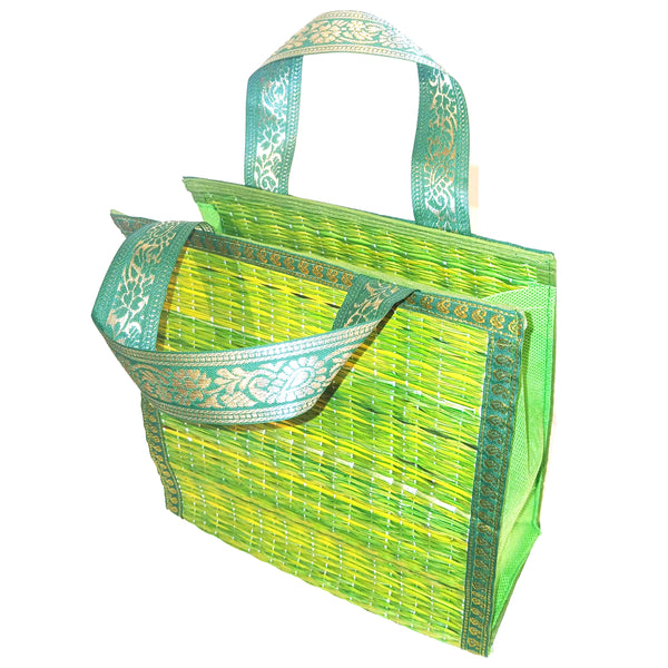 Green woven bag with decorative handles 