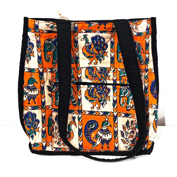 Block printed tote bag with colorful bird and elephant pattern in orange and blue