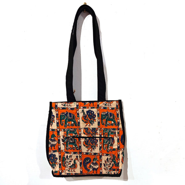 Block printed tote bag with colorful bird and elephant pattern in orange and blue