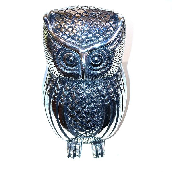 Decorative owl-shaped object with a metallic finish 