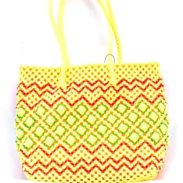 Yellow woven handbag with red and n a white background