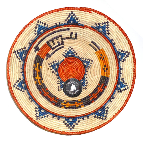Decorative woven basket with blue, orange, and beige patterns.