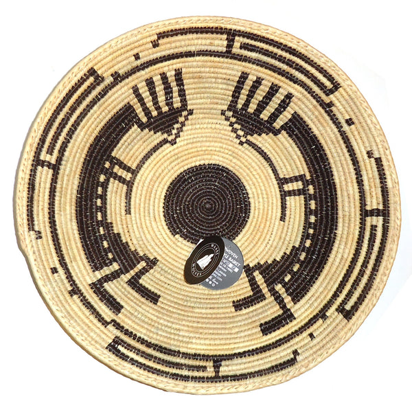 Woven basket with brown dancers.