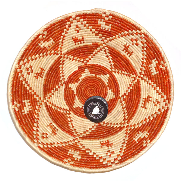 Woven basket with orange and beige pattern 