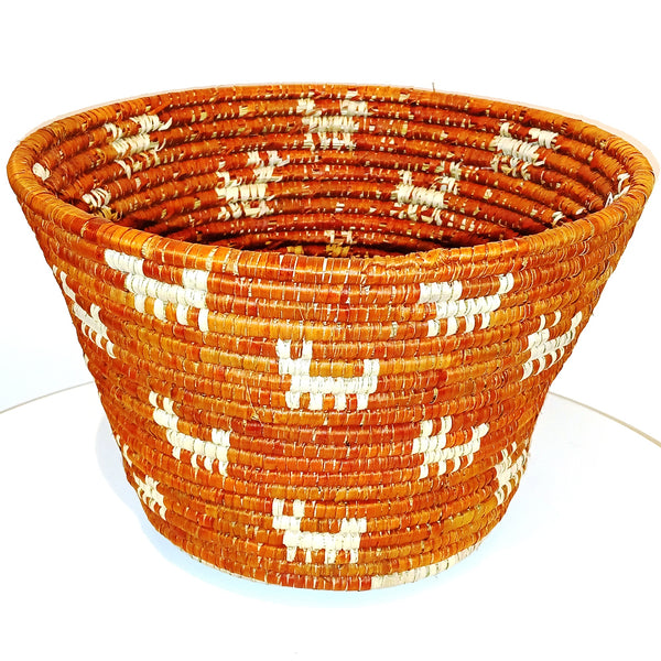 Woven basket with orange and white animal pattern 