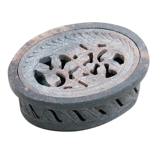 An oval-shaped carved stone soap dish with a perforated top and decorative leaf patterns, shown on a plain white background.