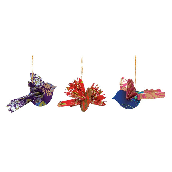 Three colorful paper origami bird ornaments in various colors and patterns.