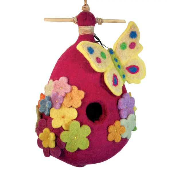Colorful felt birdhouse with flowers and a butterfly.