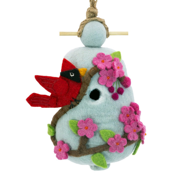 Felt birdhouse with a red cardinal and pink cherry blossoms. 