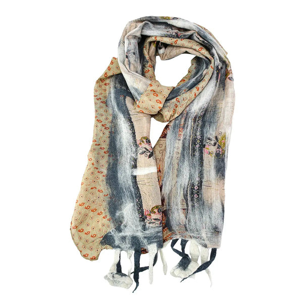 A silk and felt scarf with a mixed abstract and vintage illustration print, featuring blue, gray, beige, and orange tones, with flower tassels.