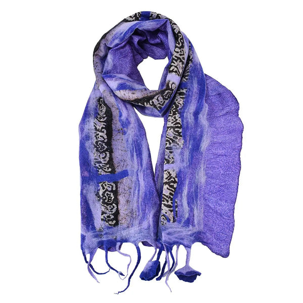 Purple scarf with black and white pattern and flower tassels.