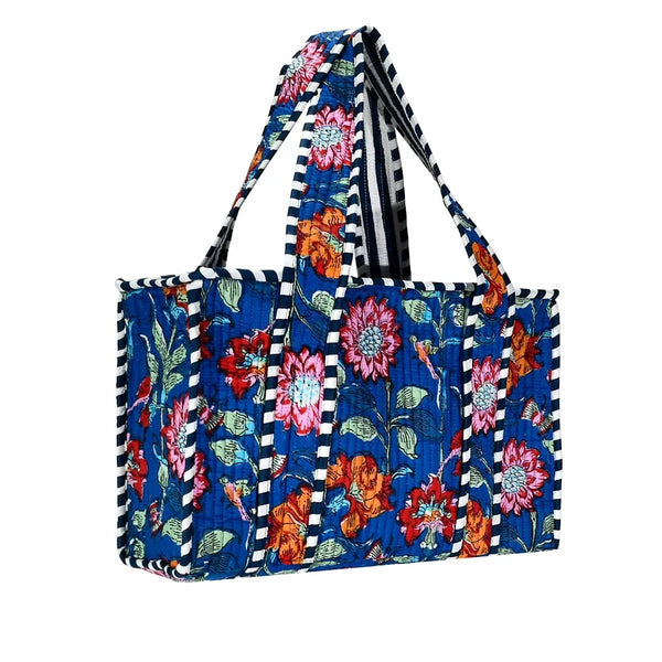 Floral patterned tote bag with black and white striped piping