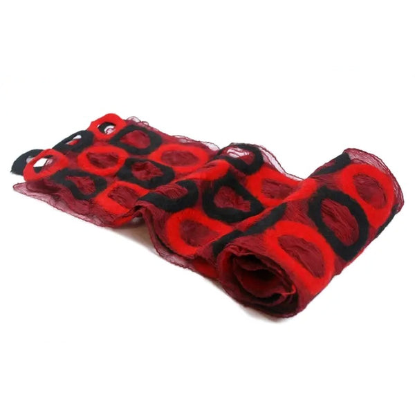 A red and black patterned sheer scarf with a textured, circular abstract design.