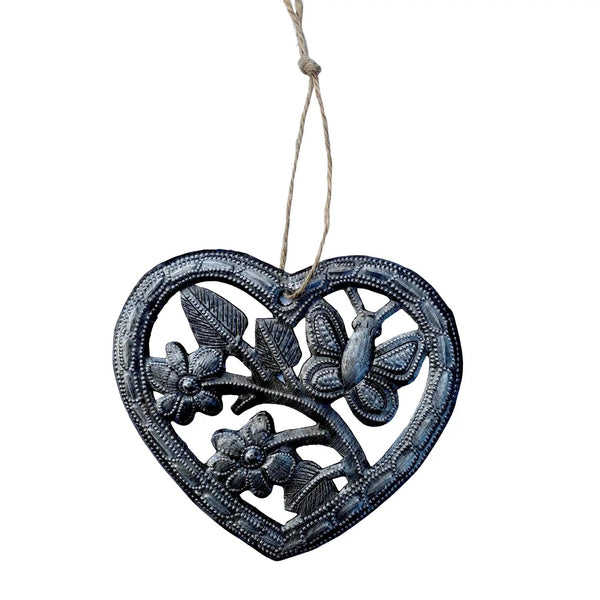 Decorative heart-shaped ornament with a butterfly and floral design 