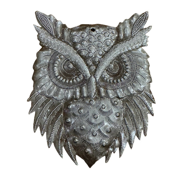 A metallic silver owl wall hanging with intricate textured patterns and raised details