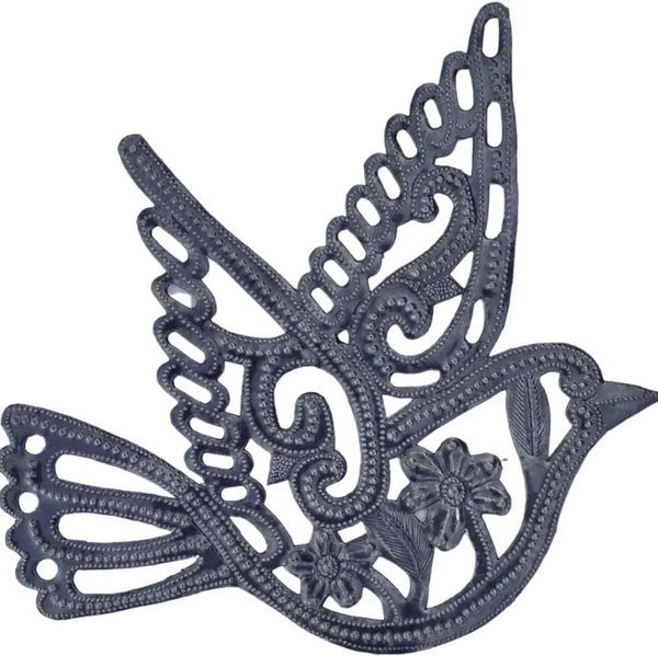 A dark gray metal decorative wall hanging shaped like a flying dove with floral details