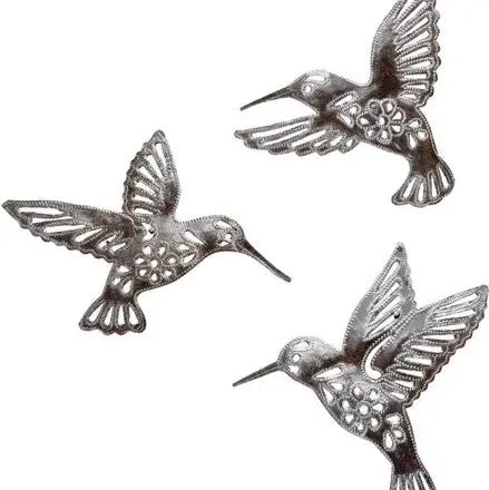 Three silver-toned metal hummingbird wall sculptures with floral details on their bodies.