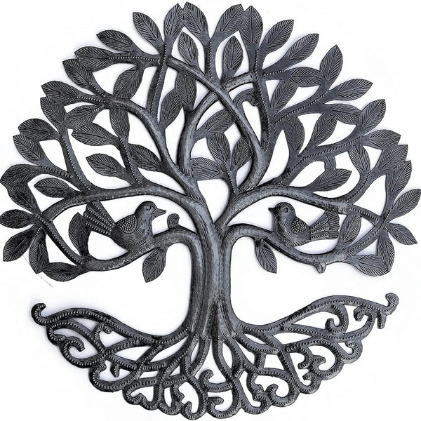 Decorative metal wall art of a tree with branches and leaves.